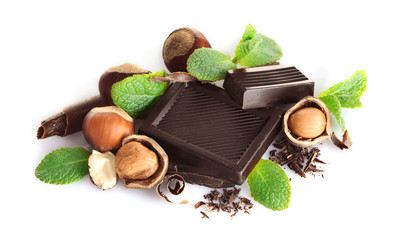 Chocolate with mint and hazelnuts on white background
