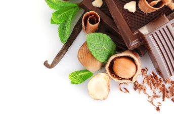 Chocolate with mint and hazelnuts on white background
