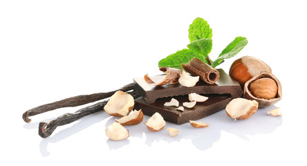 Chocolate with mint and hazelnuts on white background