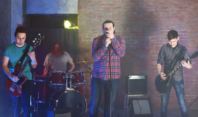 Music band performing on stage.