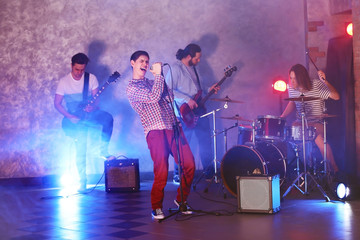 Fototapeta na wymiar Music band performing on stage.
