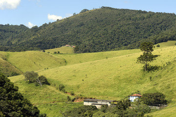 Green hills with farm house
