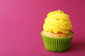 Birthday cupcake on pink background