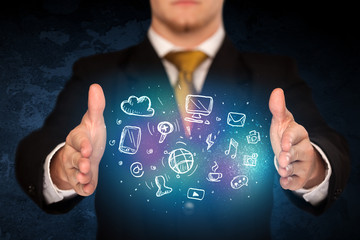 holding hand drawn media icons