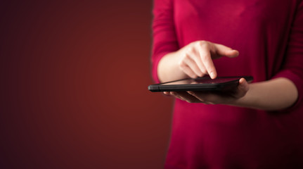 Close up of hand holding digital touchpad tablet device