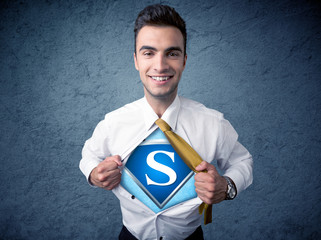 Businessman ripping off his shirt with superhero sign