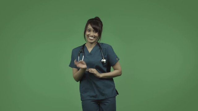 indian female doctor isolated on greenscreen happy dance