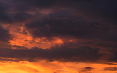 Naklejka na ściany i meble Sunset with rain clouds