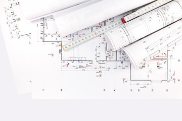 architectural drawings, rolls of blueprints with ruler