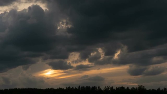 Beautiful sunset through the many layers of clouds.  timelapse
