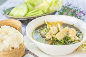 Laos curry  (Thai call Kaeng Nor Mai Sai Biyanang or Kaeng Lao or Tom Prer) baby bamboo pumpkin and mixed vegetable Shoot Soup the traditional delicious Northeastern Style Thai food.