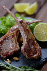 Closeup of grilled lamb shoulder rack steaks, selective focus