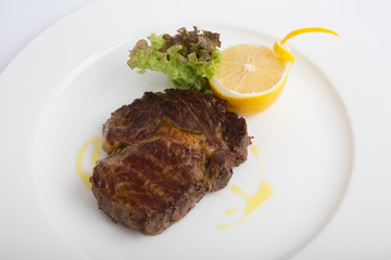 Ribeye steak with lemon