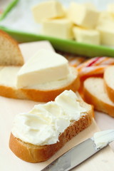 Slice of bread with cream cheese and butter for breakfast