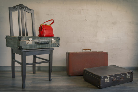 Old suitcases and red bag