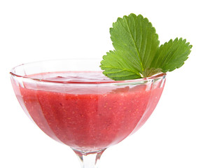 Close photo of strawberry dessert in goblet with leaf on white