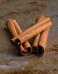 cinnamon sticks on steel plate