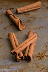 cinnamon sticks on steel plate