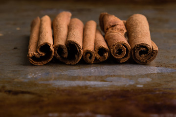 cinnamon sticks on steel plate