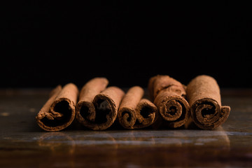 cinnamon sticks on steel plate