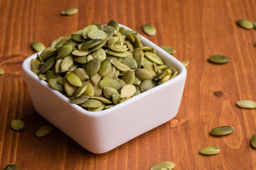 pumpkin seeds in a white bowl