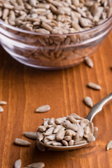 sunflower seeds on wooden table