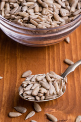sunflower seeds on wooden table