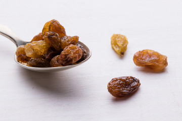 raisins on steel spoon