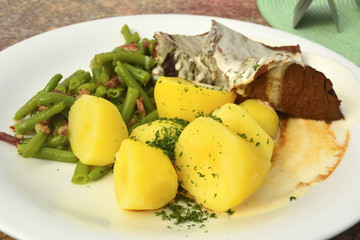 Smoked boiled beef with horseradish sauce, slice beans and boiled potatoes.