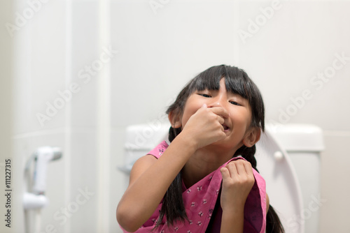 Asian Girl Sitting On Toilet Stock Photo And Royaltyfree Images On