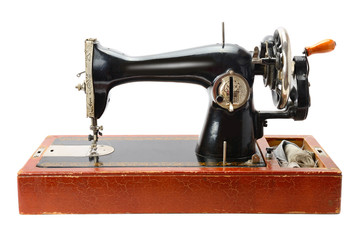 Antique sewing machine isolated on white