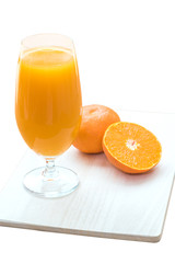Glass of fresh orange juice isolated on white background