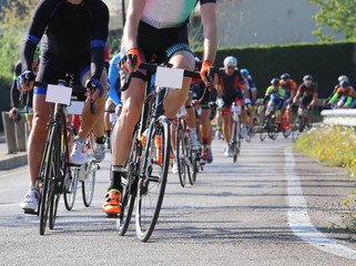 Fototapeta na wymiar racing bikes led by trained cyclists during the street race