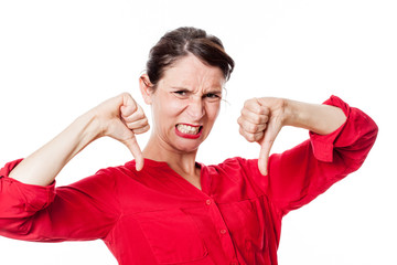 enraged young woman with aggressive thumbs down grinding teeth