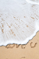 Love U sign on the sand beach copy space texture background 