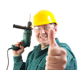 smiling repairman with a drill, gesturing thumbs up, clipping path included
