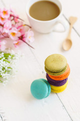 Colorful macaroons and a cup of coffee
