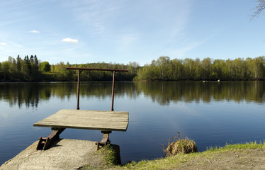 A very littel jetty at the shore of a river in the North of Sweden.