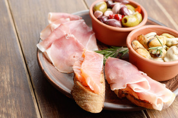 Tapas of salmon, mussels, jamon and olives