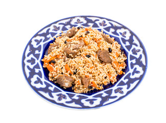 Fragrant pilaf with meat and dried apricots.