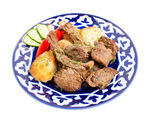 Baked lamb racks with vegetables garnish.