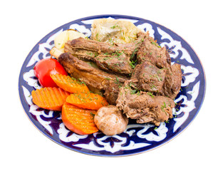 Baked lamb meat with stewed vegetable mix.