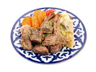 Baked lamb meat with stewed vegetable mix.