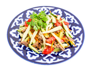 Delicious veal salad with cucumbers and avocado.