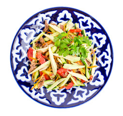 Delicious veal salad with cucumbers and avocado.