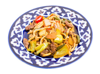 Baked lamb with noodles and stewed vegetables.