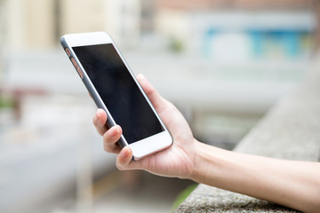 Woman holding a mobile phone