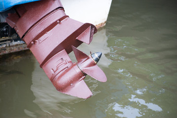 Fishing boat detail with outboard engine and propeller
