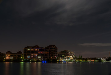 Fototapeta premium Autumn view of riverside apartments in the evening.