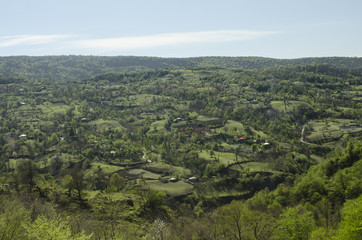 Naklejka premium panorama of green valleys with houses